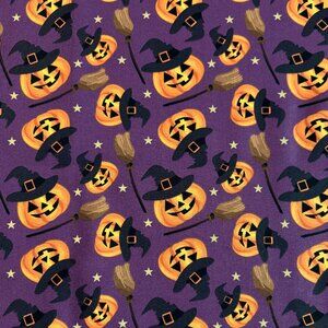 Pumpkins and Witches Brooms on a Purple Background Cotton Fabric